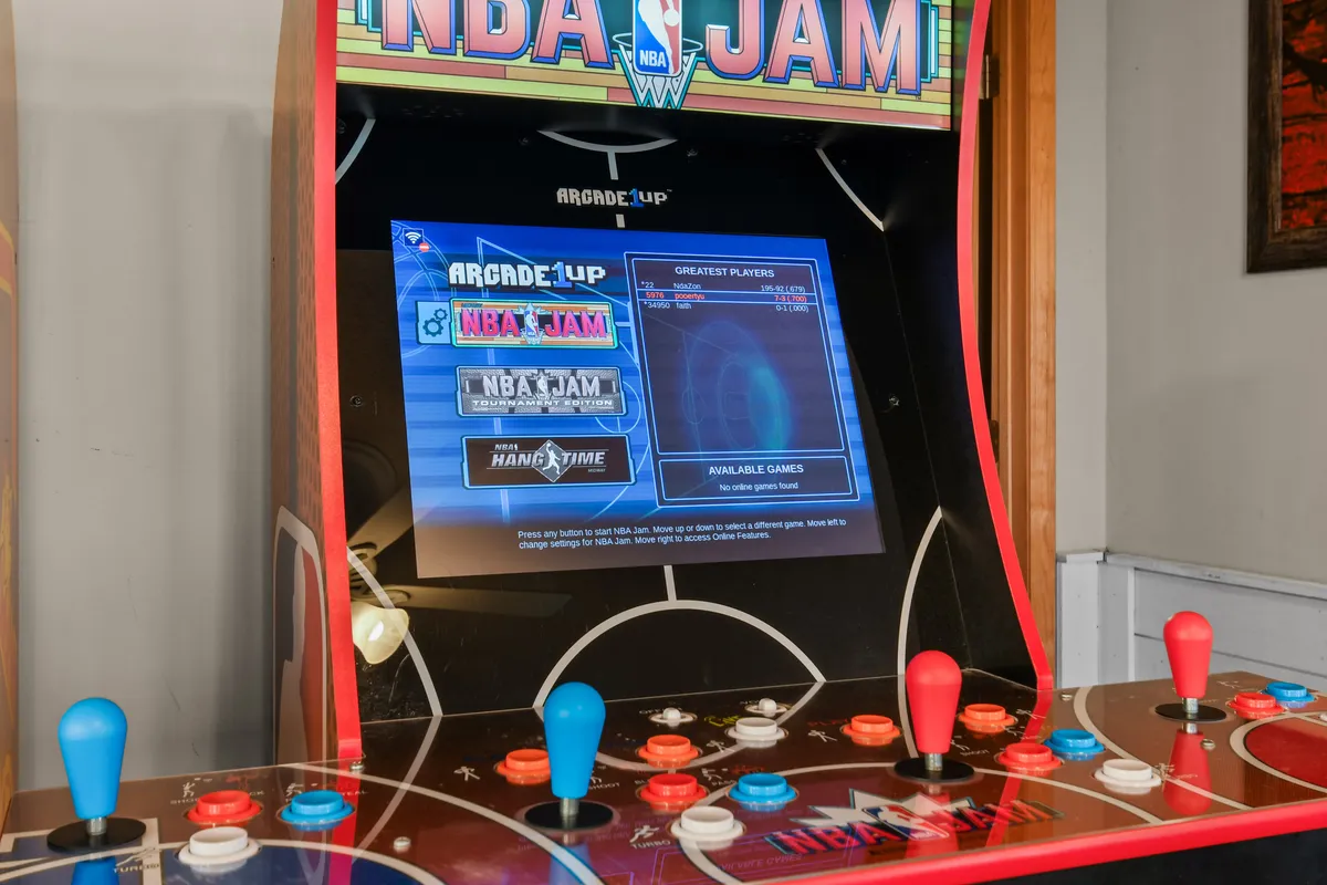 A close-up of a retro arcade game machine with colorful joystick controls, radiating energy and nostalgia. The focus is on the arcade experience, hinting at the thrill of classic competitions and fun group activities for all ages.